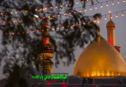 عکسی از گنبد طلایی حرم حضرت عباس و مناره های آن
